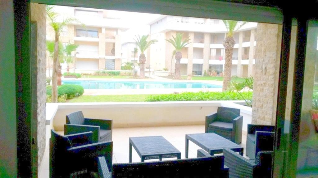 Apartment with 3 bedrooms in Sidi Bouknadel with shared pool and terrace image 1