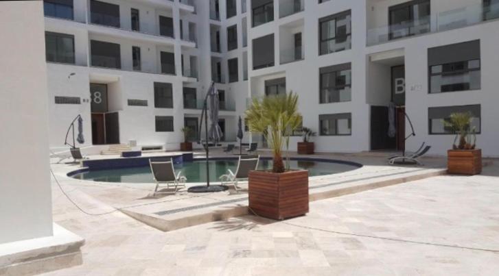 TheSuites AGADIR BAY apartments balcony.pool&park image 8